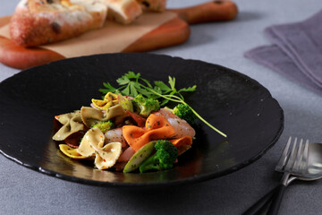 This is a delicious and hearty dish of farfalle pasta. The pasta is cooked to perfection and the sauce is rich and flavorful. It is perfect for a quick and easy meal or a party appetizer.
