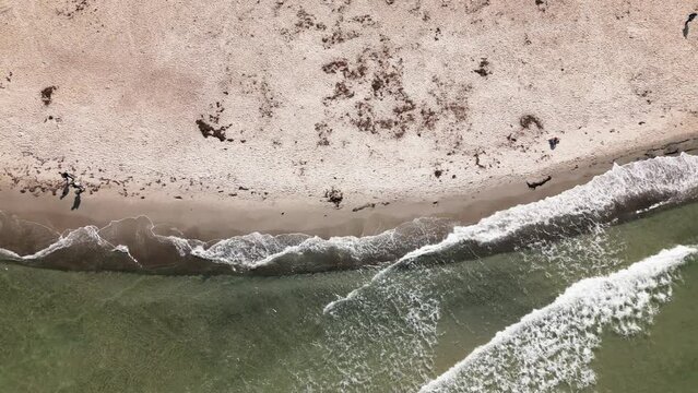 waves hit the beach, people walk along the beach, baltic sea, warnem&uuml;nde, drone