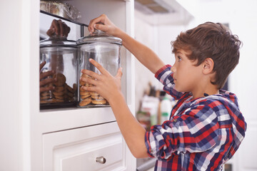 Cookies, kitchen and snack for boy in house for steal, sneaky or sugar in pantry or cupboard for...