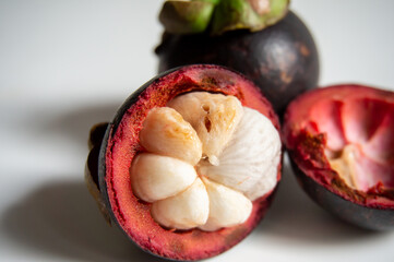 poor quality of mangosteen fruit due to pests on a white background