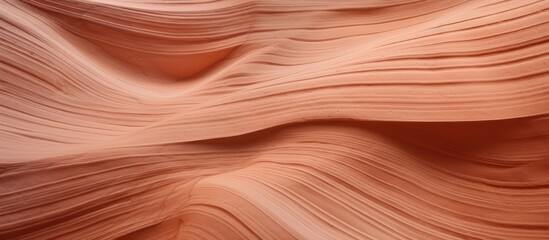 A close up of a sand dune in the desert resembles the intricate pattern of hardwood flooring stained in a warm peach color, creating a stunning landscape formation