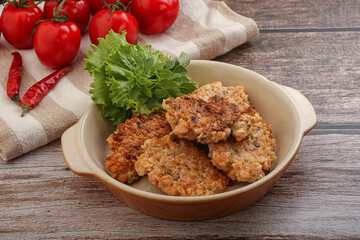 Fried salmonn cutlet in the bowl