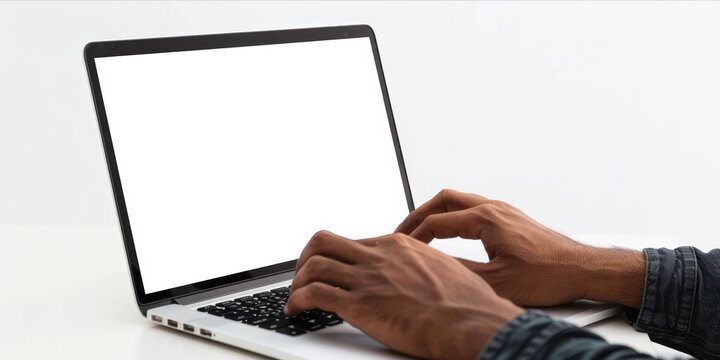 Person using a laptop with a blank screen