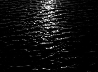 Photographs of water surfaces with light and shadow and natural movement.