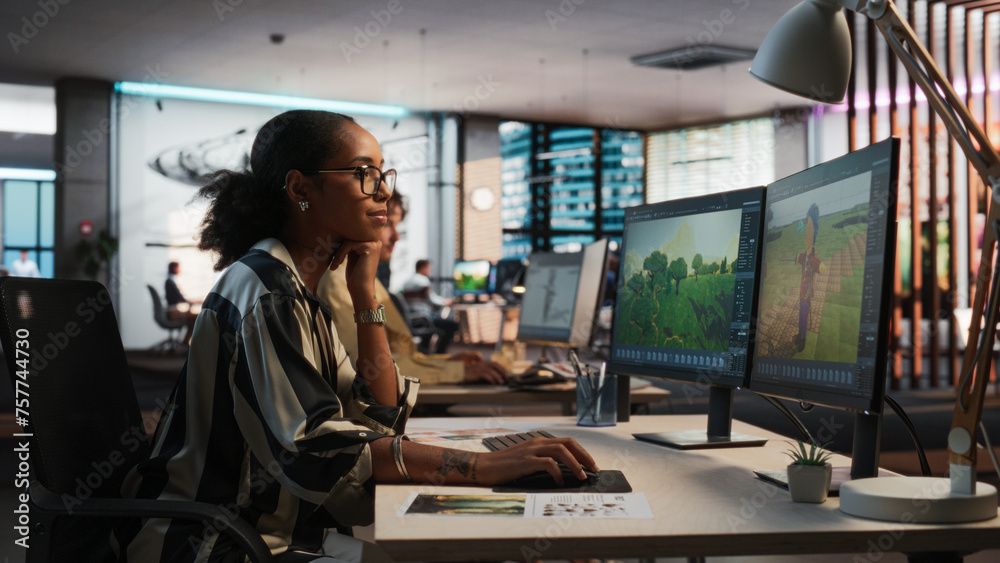 Poster Female Black Game Developer Using Desktop Computer, Designing Unique World And Characters In 3D modelling Software For Adventure Video Game. African Woman Working In Diverse Game Design Studio Office.