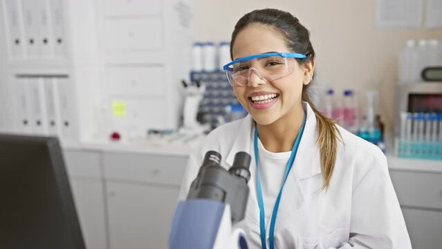 Beautiful latin scientist's infectious laughter in lab after crazy joke