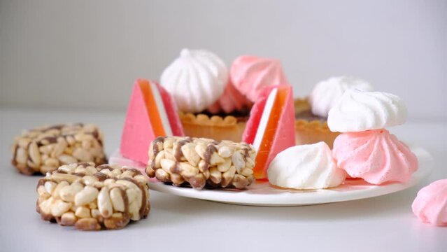Luxury handmade chocolate mendiants, cookies, bites, candies, marmalade, chocolate baskets, marshmallow, wheat grain rice crackers 