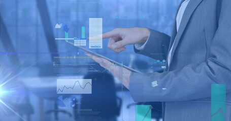 Image of financial data processing over businessman using tablet in office