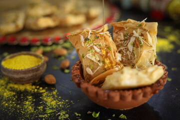 Gujhiya, Indian fried sweet with dry fruits and fancy decorative background