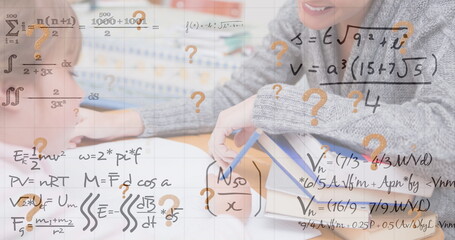 Image of mathematical equations over caucasian schoolkid with smiling teacher in classroom