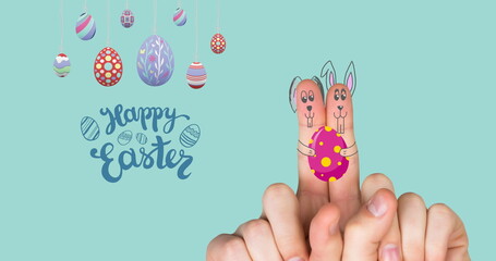 Obraz premium Image of happy easter, eggs and fingers paint as bunnies on mint background