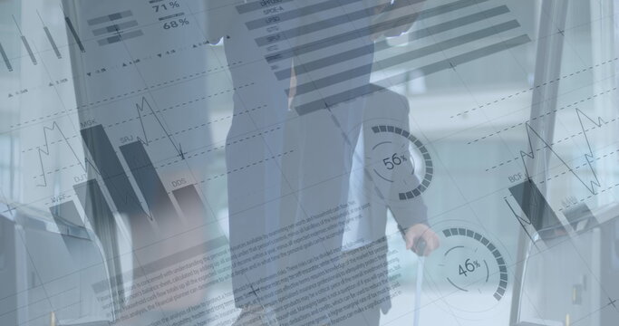 Image of financial data processing over business people using escalator in office - Powered by Adobe