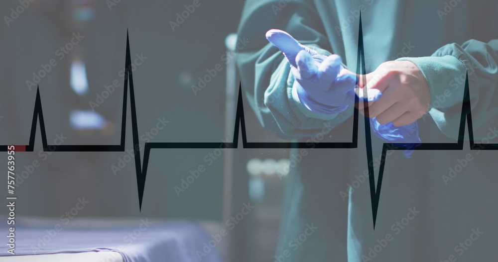 Poster image of cardiograph over caucasian male surgeon wearing medical gloves at hospital