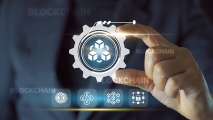 Businessman hand holding a blockchain technology in the realm of innovation, advancement,...