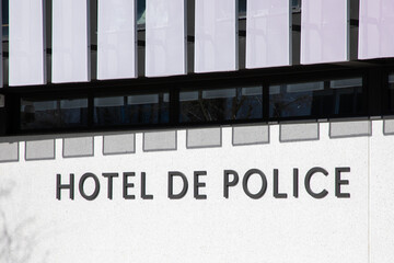 hotel de police text sign french means police station front of office building France facade office...