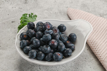 Sweet ripe blueberry on the bowl