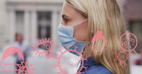 Image of virus cells and icons over caucasian woman wearing face mask
