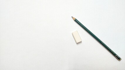 Stationery pen, pencil and eraser are on a white background for writing an idea
