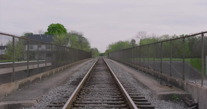 Moving forward Establishing shot of train tracks with leading lines