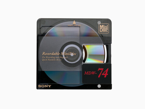 Sony MDW-74 minidisc with an open protective flap and a rainbow reflection from the disc surface