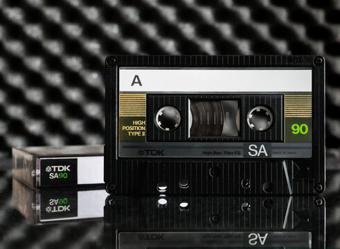 Audio cassette TDK SA90 (Super Avilyn Technology) from 1986 on a mirror tabletop