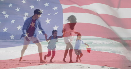 Image of flag of united states of america over biracial couple with children by seaside