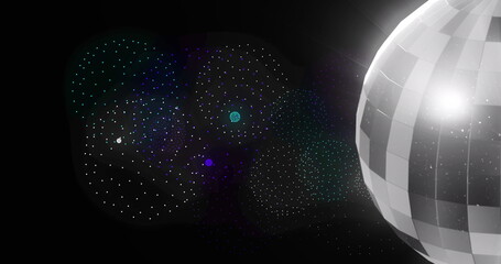 Image of disco ball over shapes and fireworks on black backrgound