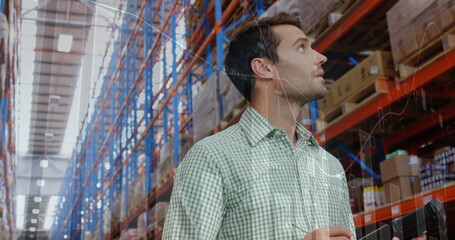 Image of data processing over man working in warehouse