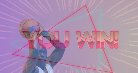 Image of you win text over neon pattern and african american basketball player