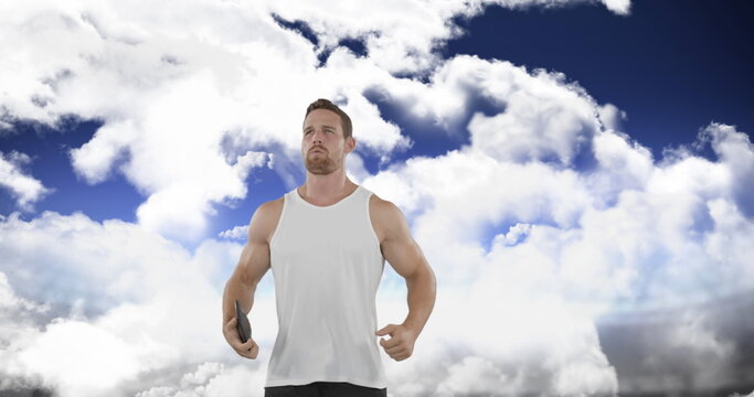 Digital image of a Caucasian man limbering up by jumping up and down in preparation for a disk throw