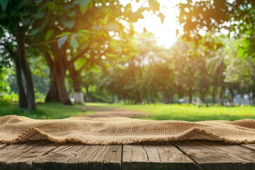 Naklejka na ściany i meble Nature background and table wood for product display template, Empty wooden table and sack tablecloth over blur green tree at park, garden outdoor with bokeh light background - generative ai