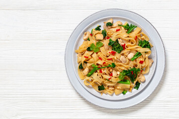 rice noodles with chicken, eggs, chinese broccoli
