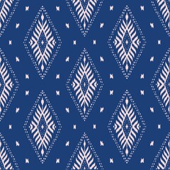 Obraz premium indigo blue oriental traditional native fabric seamless pattern for ikat and batik. hand drawn embroidery pattern.