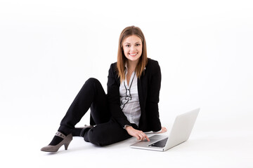 Portrait of a stylish Businesswoman using a laptop.