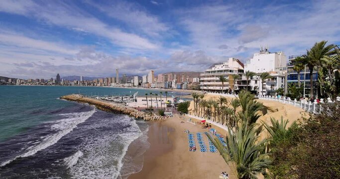 Footage of the beautiful town of Benidorm showing the Cala del Mal Pas Beach on a sunny summers day in the summer time.
