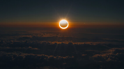 Solar eclipse with sun partially obscured by moon, high up view