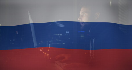Image of caucasian male hacker over flag of russia