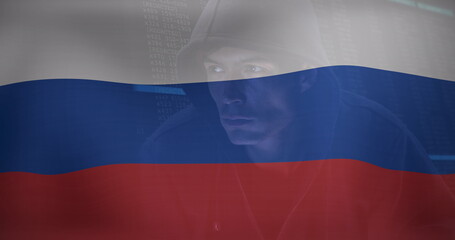 Image of caucasian male hacker over flag of russia