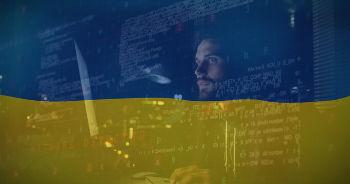 Image caucasian male hacker and data processing over flag of ukraine - Powered by Adobe