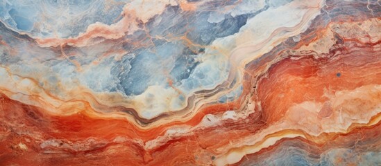 A close up of a painting capturing the intricate marble texture, featuring a blend of browns, peaches, and rock patterns resembling a natural landscape reflected in water