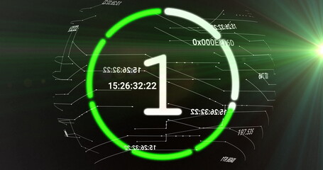 Image of countdown to midnight in circle on black background