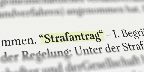 Das Wort Strafantrag im Buch mit Textmarker markiert