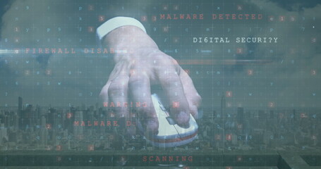 Image of cyber attack warning with hand holding computer mouse over cityscape