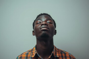 Fototapeta premium Young Man Looking Upwards Thoughtfully 