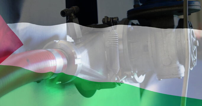 Image of oil pipe over flag of palestine - Powered by Adobe