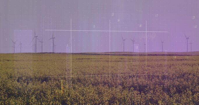 Image of financial data processing over wind turbines and landscape