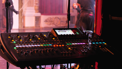 A captivating view from the sound mixing console at a live concert, showcasing the stage, audio...