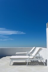 sun lounger on the roof terrace. blue sky, white terrace. generative ai