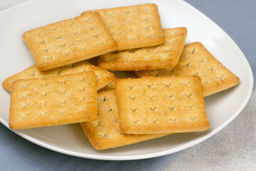 Biscuit Cracker with sugar on ceramic white plate