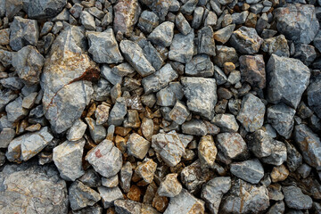 Top view various size of granite stone on the ground